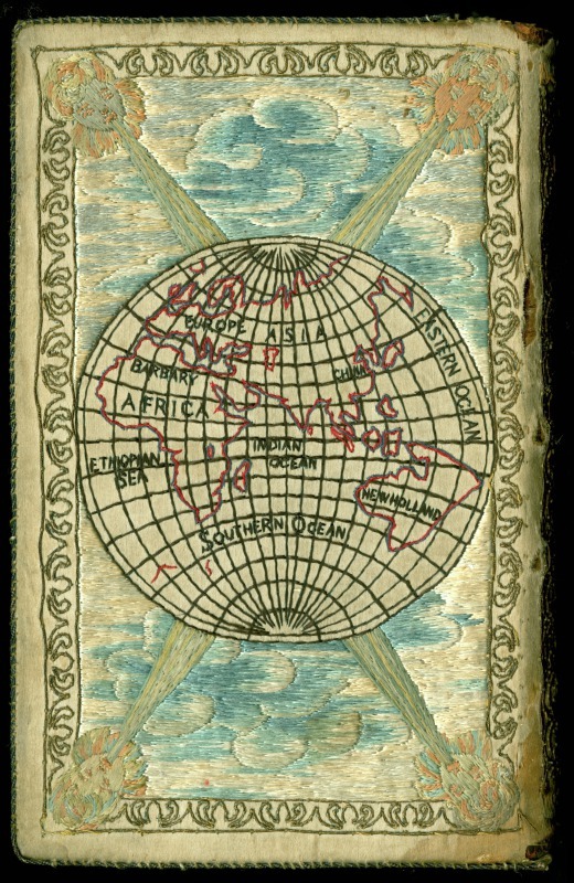 Couverture de livre brodée : une mappemonde avec les 4 les vents, figurés par des têtes humaines joufflues qui soufflent vers le centre.